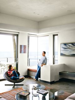 Bryan and Robin relax in a corner of the living room; the custom rug is from the Rug Affair.<br>