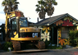 A "before" shot of the couple's original home before it was demolished to make way for the current residence. Says Cranston, "It was really fun—we called it the "love shack." But it truly outlived its purpose, and it was incredibly wasteful, energy-wise."