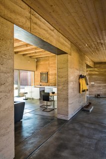 A Sustainable Rammed Earth Home in New Mexico - Photo 3 of 5 - Marrying the interior with the outdoors informed the design, as did the concept of subtraction: "If you do it with two, then you can do it with one," Maniatis says, articulating Roger’s algebra of minimalism. Photo by: Kirk Gittings