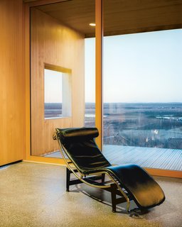 This Modern Cabin Is the Ideal HQ For a Family in Alaska - Photo 7 of 19 - Le Corbusier, Charlotte Perriand, and Pierre Jeanneret designed the LC4 Villa Church lounge for Cassina.