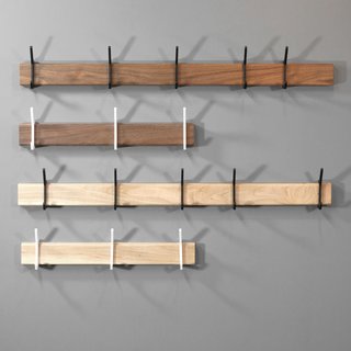 A set of hooks installed on the back of a closet door can provide much-needed extra storage space.