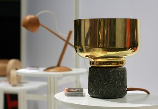 Morse lamp by Morten&Jonas. The series of lamps made out of spun brass; the base is granite stone from Norway, handcrafted into two soft and warm shapes.