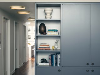 To make a display feel more balanced, divide items around a central piece and opt for odd numbers, instead of even.