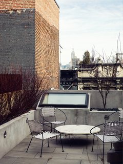 Skylights are visible—and easily reached for cleaning—from this rooftop terrace in New York.