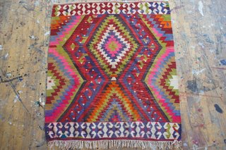 Roughly four-foot-square vintage flatweave rug from Turkey with a geometric pattern, sold by Aelfie. ($410)