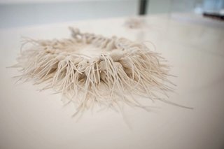 Designer Tzuri Gueta showcased his sculptural accessories in a solo exhibition at Testa Gallery in Sofia. The Paris-based artist, craftsman, and scientist has extensive experience as a trend forecaster as well as a being a collaborator with Haute Couture fashion designers. With a background in textile engineering, Gueta's patented technique of 'lace fed with silicone' allows for a surrealistic and sensual approach to organic form building. Photo courtesy of Tzuri Gueta and Testa Gallery.