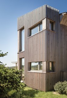 The exterior is clad in eastern hemlock. "It’s local, it’s native, and it’s actually got a good bit of resistance," Winkelman says of the material, "and we could mill it to a unique dimension."