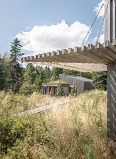A verdant tundra that the architect dubbed the "courtyard" separates Bullitt’s house from his 900-square-foot studio. The space, which is planted with Bog Myrtle, bearberry, and other native plants, "reinforces...the dominance of the landscape over the building," the architect says. "The end result was an exceedingly naturalized setting."