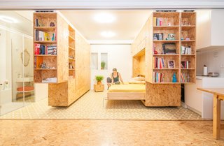 <span style="font-family: Theinhardt, -apple-system, BlinkMacSystemFont, "Segoe UI", Roboto, Oxygen-Sans, Ubuntu, Cantarell, "Helvetica Neue", sans-serif;">Madrid-based firm PKMN dreamed up this flexible concept for a client with a tiny home north of the city. Made up of three shelving units on track system, the All I Own House can be configured in countless ways, making space for a bedroom, kitchen, sitting area, changing room, and more. </span><span style="font-family: Theinhardt, -apple-system, BlinkMacSystemFont, "Segoe UI", Roboto, Oxygen-Sans, Ubuntu, Cantarell, "Helvetica Neue", sans-serif;">Shown here is a horizontal Murphy bed, which makes a great space-saving solution as well as a comfortable sleeping space.</span>