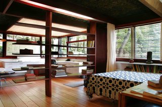 The Remarkable Home of Modernist Designer Russel Wright - Photo 5 of 9 - Wright's bedroom with his studio, seen just beyond through his bookshelves.