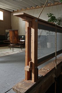 "Most of the core structure; including the industrial stairs, lofted area and railings were here," Anderson and Woitunski say, "but all of the walls were painted flat gray. It felt a little like a big, cavelike storage area, but the unique structure gave us a really good starting point. The previous tenants were steel fabricators, so there was an inherent industrial feel to the elements they had installed." Photo by Yardwork Co.