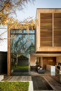 The large sliding doors feature a telescoping design, which means they fit into one another and can therefore maximize the opening to the yard.