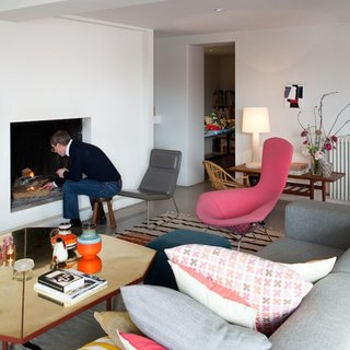 Renaud de Poorter lights a fire in his Bellum, Belgium, residence.