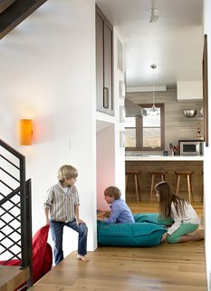 A Custom, LED-Lit Slide Twists Through This Family-Friendly Vacation Home - Photo 5 of 11 - An interior slide was the first of the unexpected amenities the homeowners requested.