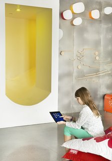 A Custom, LED-Lit Slide Twists Through This Family-Friendly Vacation Home - Photo 7 of 11 - The LED lighting in the slide is just one of the high-tech elements in the house that can be adjusted from a smartphone or tablet. A computer system in the basement controls the screens in the house as well as the security and heating systems.
