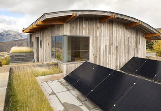 A Custom, LED-Lit Slide Twists Through This Family-Friendly Vacation Home - Photo 10 of 11 - Rooftop Sunpower X-Series solar panels installed by Creative Energies of Victor, Idaho, generate about a third of the energy for the house over the course of the year. On clear, sunny summer days, they can provide energy for the entire house. Another green feature, the planted roof, was inspired by a trip to Norway.