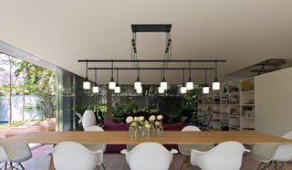 Shown here is another iteration of the modular Suspenders system, comprised of interconnected linear arms that support suspended LED luminaires. The collection can be configured in multiple graphic shapes and scales, with interchangeable luminaires in single drops or cluster formations.