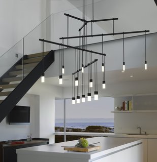 One of the ways Suspenders can be arranged is in a Tri-Bar configuration. Hanging from a ceiling-mounted outlet box transformer is a 24" tri-bar that supports three 36" linear power bars, each with five LED luminaires.