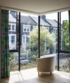 Milman Road Renovation: Rear Window View<br><br>"What struck us as funny was the corner bay window," says architect Oliver Barsoum. "It’s almost like you’re surrounded by glass on all sides. That’s where the project began." The vision became playing with and pushing that window into three dimensions.<br><br>Photos by Syte Architecture