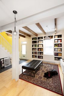 Locally sourced Canadian plywood was used for the flooring throughout the home, and all doors and windows were replaced with low-energy upgrades. The couple shares their space with guide dogs they foster through a local organization.