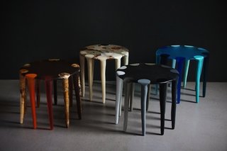 In a nod to their symbiosis with art, the couple likens their work with table creation to that of the painter’s palette. "Resin is like working with paint, each color is mixed and poured by hand then hand sanded. The side tables are like functional works of art," says Olsen.