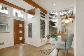 A Tiny Backyard Studio in Seattle Filled With Midcentury Finds - Photo 4 of 8 - The architects worked closely with the clients to match the aesthetic of the vintage furniture they collect. The midcentury modern Danish chair, seen right, has been refurbished and reupholstered.
