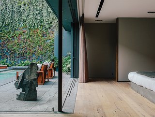 10 Retreats in Mexico For the Modernists Who Love the Outdoors - Photo 5 of 10 - Solid European oak flooring by DuChateau runs throughout the home. The sculpture is by Jorge Yázpik.