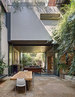 10 Retreats in Mexico For the Modernists Who Love the Outdoors - Photo 2 of 10 - In the outdoor dining room, wire chairs by Harry Bertoia for Knoll surround a mango wood table made by a local carpenter, Diego Madrazo.