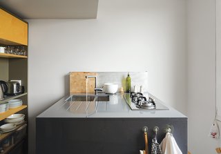 The kitchen features a compact cooktop by Whirlpool.