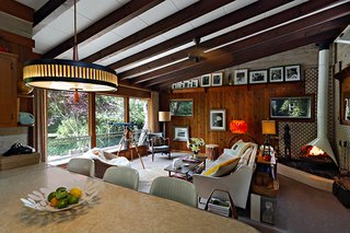 While Fire Island boasts work by a bevy of big-name architects, this Bay Walk house from 1961 proves that the island's architectural ties run much deeper. A typical early '60s beach shack by an unknown architect, it transcends its humble origins through the meticulousness of its restoration and the modernist garden design by current owners James Streacker and Scott Ahlborn.