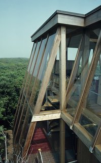 Few architects changed the face of Fire Island as much as the midcentury master Horace Gifford. In 1975, he created this geometric glass "tree house" on Sail Walk, which sports screened vents between slanted glass walls and suspended floors that draw breezes through a chimney-like skylight.