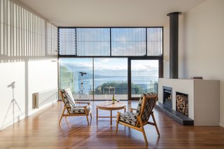 Snowdon calls the design of the entire house a collaborative process with the clients, who actually recycled a good deal of furniture from their previous beach house, such as the coffee table and arm chairs seen here