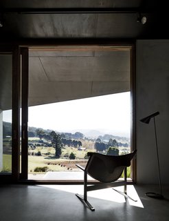 A Clement Meadmore Sling chair provides a favorite vantage point for sipping coffee while looking out at Hanging Rock. "It’s always hard to leave and return to the city," Titania says.
