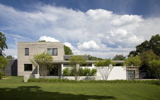 With its green features, durable materials, and clean-lined minimalism, the house represents the new generation of building for its mostly colonial neighborhood.