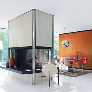 Built in 1957, Witthoefft House was designed and lived in by the architect Arthur Witthoefft. At the time, he was an architect in the Manhattan office of corporate modernists Skidmore, Owings & Merrill. This recently restored 1957 modernist masterpiece features a freestanding travertine-and-steel fireplace, open on all four sides, that divides the living and dining areas.