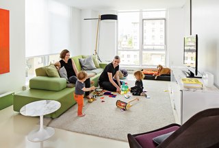 Smith, Grimley, Roen, and Mae gather around a Polder Sofa XL by Hella Jongerius for Vitra. The marble Saarinen side table is from Knoll and the Slow chair is by Ronan & Erwan Bouroullec for Vitra.