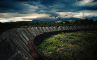 City Guide: 10 Places to Visit in Mexico City - Photo 2 of 7 - Espacio Escultórico<br><br>"The Espacio Escultórico is an amazing collaboration of artists whose intervention with the lava-covered land creates scenery that might as well be on Mars. It is located on the campus of the National Autonomous University of Mexico and is not that commonly visited even by locals. The walk through the lava is definitely worthwhile and gives a sense of scale of the art piece."