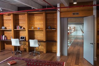A Miami Renovation That Blends Concrete and Rich Wooden Interiors - Photo 4 of 7 - Everything from lighting to curtains to video and audio can be controlled from a smartphone, enhancing the loft’s sense of effortless elegance.