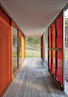 Both sets of panels slide open for maximum views and solar gain; in inclement weather, they shutter completely, while clerestory windows bathe the space in light.