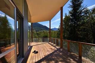 This Retreat in the Cascades is a Bold Take on the Modern Cabin - Photo 9 of 10 - "I wanted to create ‘defensible’ outdoor rooms that flowed in and around the buildings," Coleman said. The deck was built with Red Balau hardwood, which has a custom oil finish by Messmer’s.