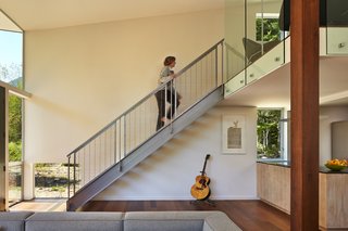 This Retreat in the Cascades is a Bold Take on the Modern Cabin - Photo 6 of 10 - The cabin and studio each have one bathroom and one bedroom, and the entirety of the property has geothermal heat and super insulation. The custom-made stairs in the cabin are by Westside Metal Fabricators in Mount Vernon, Washington.