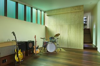 This Retreat in the Cascades is a Bold Take on the Modern Cabin - Photo 5 of 10 - The 1,000-square-foot studio includes a wood shop and music room. The Red Balau wood flooring was treated with Osmo color oil and Osmo Polyx finish. The walls are painted "white heron" by Benjamin Moore.