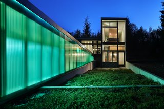 This Retreat in the Cascades is a Bold Take on the Modern Cabin - Photo 2 of 10 - Windows by Milgard allow for views of the terrace below the cabin’s bedroom and the expanse of trees beyond.