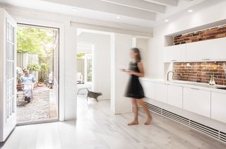 Architects who practice in dense cities know its almost impossible to add square footage to an apartment. Yet at a garden-level residence in Boston's historic Beacon Hill neighborhood, Chris Greenawalt of Bunker Workshop was able to unearth 70 square feet of living space through a little excavation.