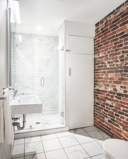 Along with historic wood and steel details, several warm brick walls were exhumed and left exposed.