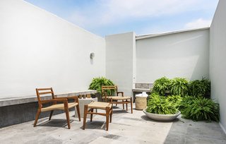 The roof decks, restaurant, and public spaces all feature furnitute designed by La Metropolitana, a design collective that produces their furniture in a workshop in nearby Obrera. These pieces combine CNC-cut wood with cord woven using a Danish technique the designers learn by watching YouTube videos. Founded in 2008, the group is working to develop small infrastructures in different cities, each operating independently with local materials, local workers, and local suppliers.