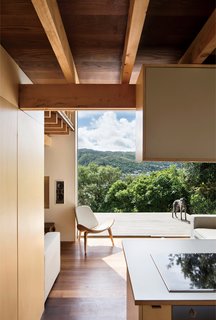 A Home's High Ceilings Are Responsible for Some Impressive Views - Photo 6 of 10 - The home also extends into outdoor panoramas, even—and especially—from the ground floor, where a westward-facing deck cantilevers out into the lush landscape.