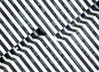 Hypnotic Building, 2014. "The saturated facade of this late-modernist 1981 office building in Houston, Texas, exposes the inner paths of its elevators, outlining the dramatic black-and-white lines with glass and aluminum," notes Olic.