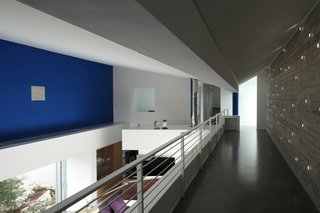 A Home That Dramatically Replicates a Starry Sky in Its Living Room - Photo 4 of 9 - As the sun angle changes throughout the day, the aperture of the facade tubing changes with it, sometimes projecting an array of individual spotlights around the living room and gallery.