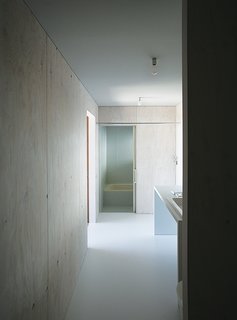 Most of the house is oriented toward the glass curtain wall overlooking the town of Odawara, save for private areas like the shared bathroom.